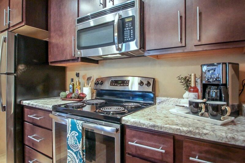 a kitchen with a stove and a microwave