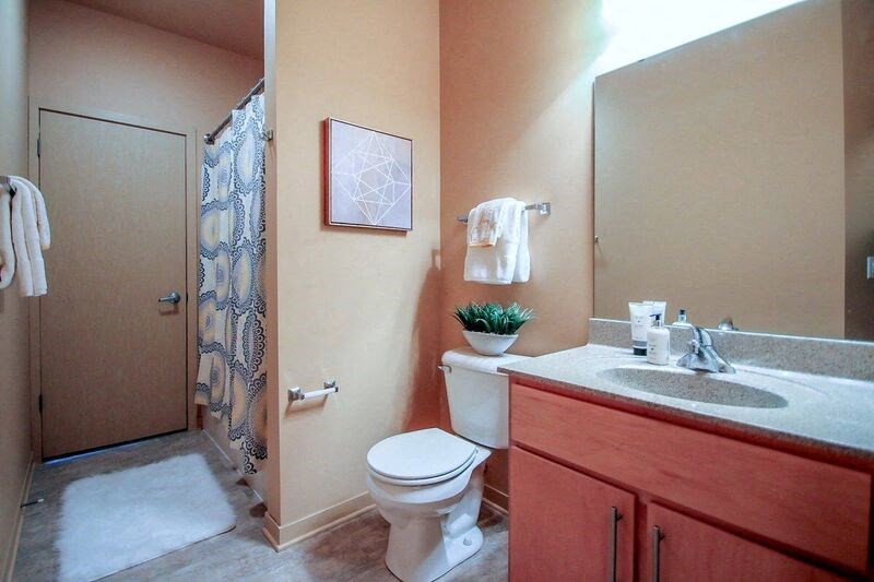 a bathroom with a sink toilet and a shower