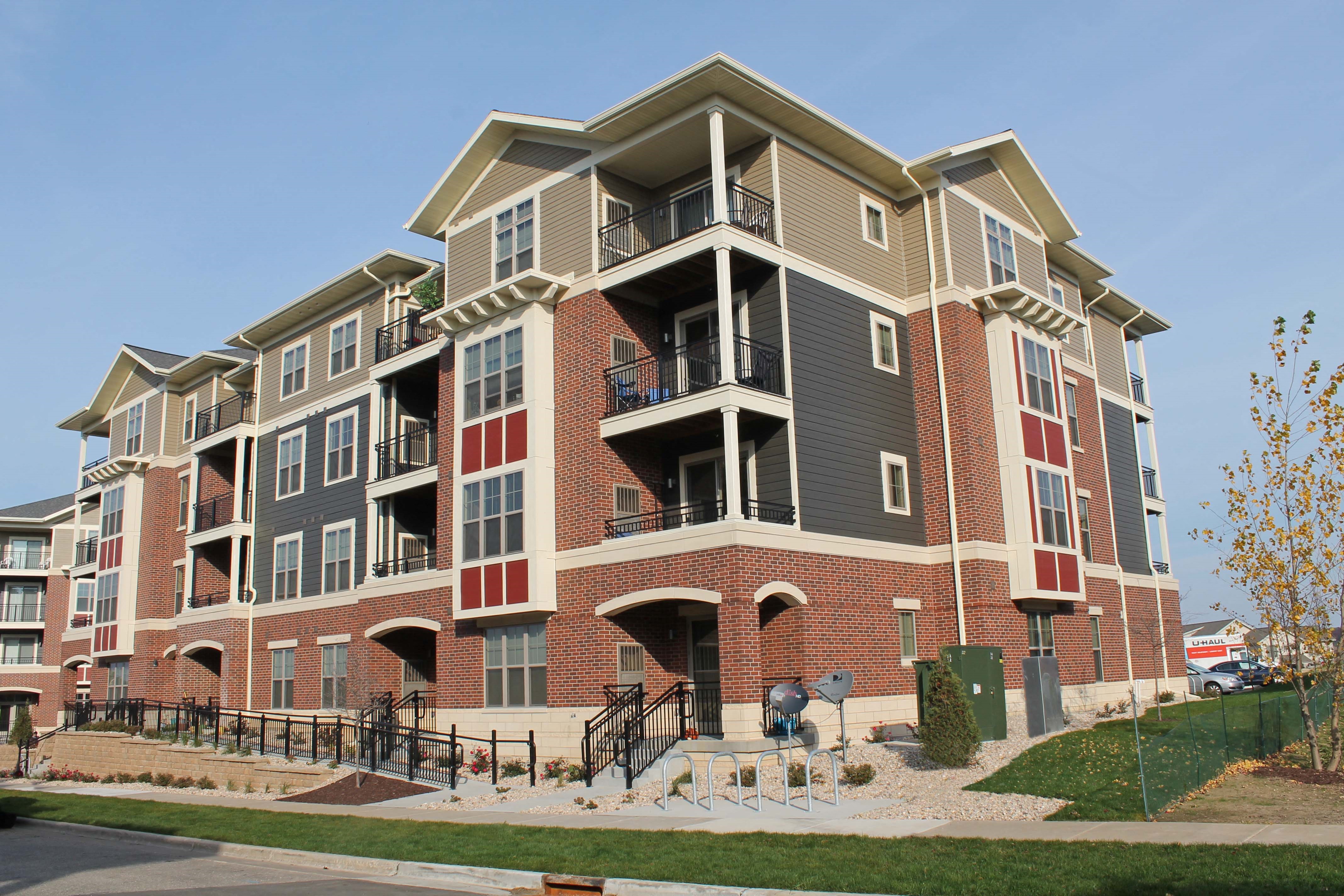 an apartment building on the corner of a street