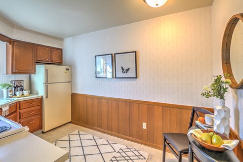 a kitchen with a sink and a refrigerator