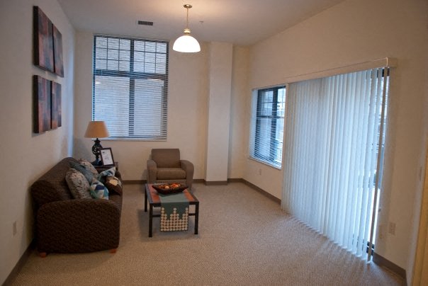 a living room with a couch and a table