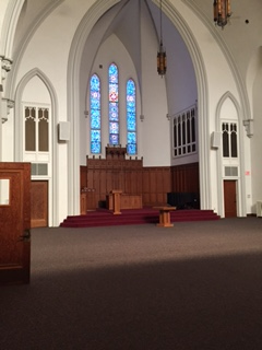a view of the altar of a church from the choir loft