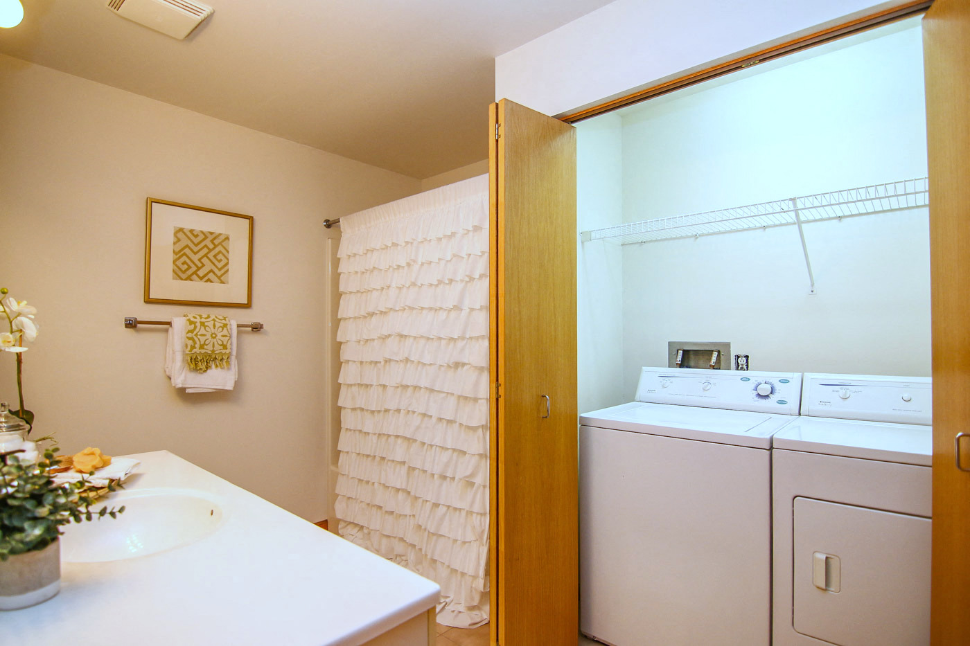 a laundry room with a sink and a washing machine