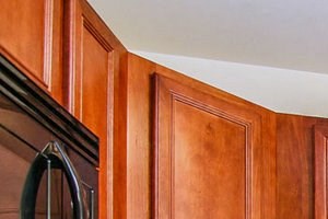 a kitchen with wooden cabinets and a white refrigerator
