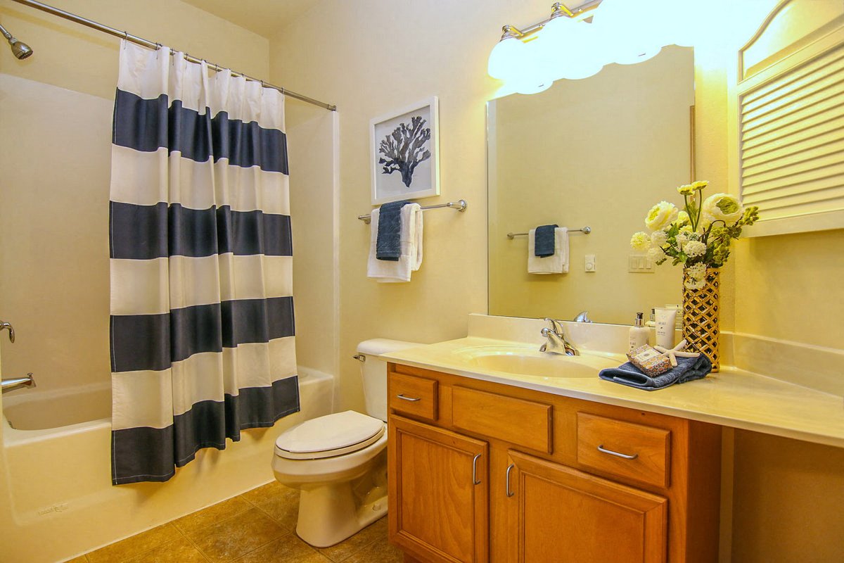 a bathroom with a sink toilet and a shower