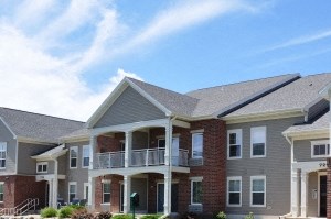 a large yard in front of an apartment building