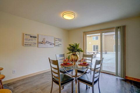 a dining room with a table and chairs