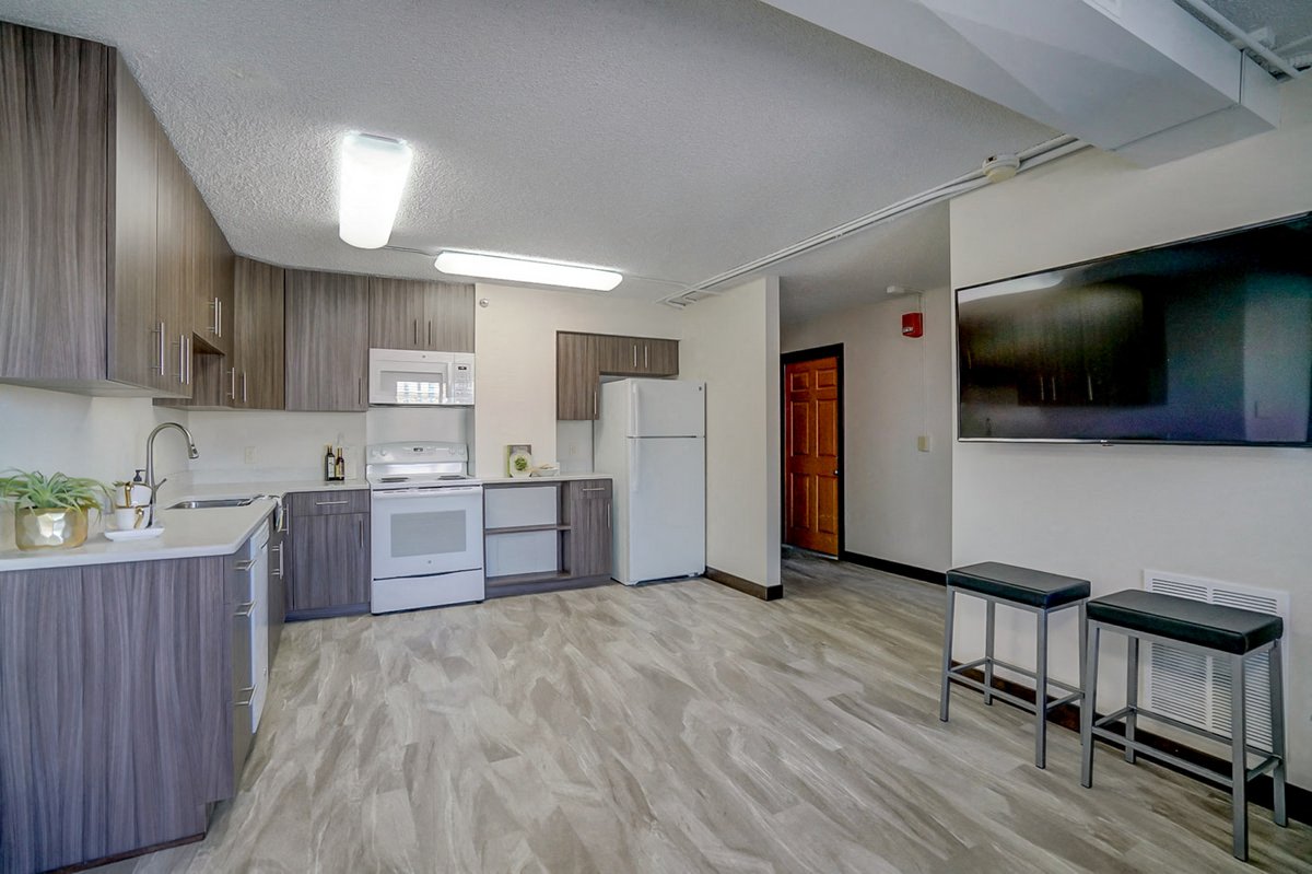 our apartments have a kitchen and a dining room with stools