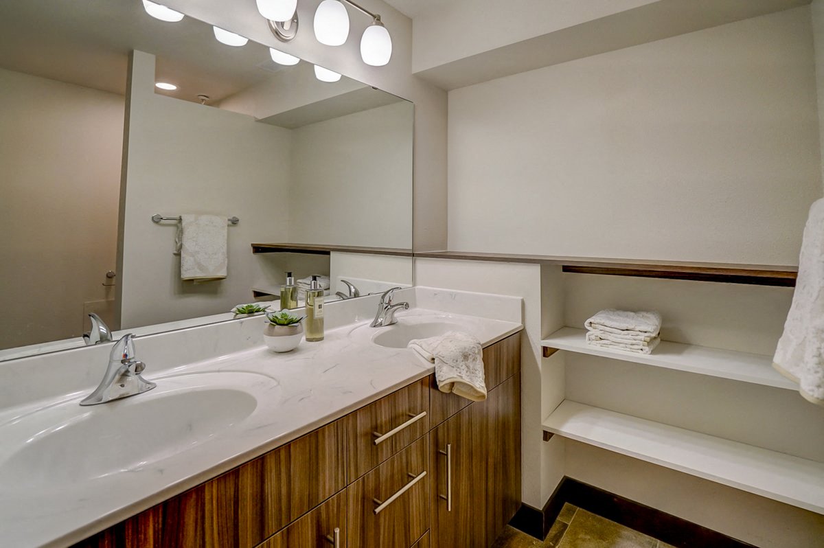 a bathroom with a sink and a mirror