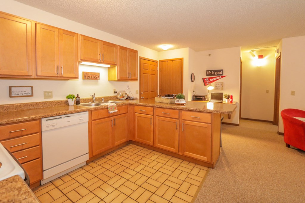 a kitchen with wooden cabinets and a counter top