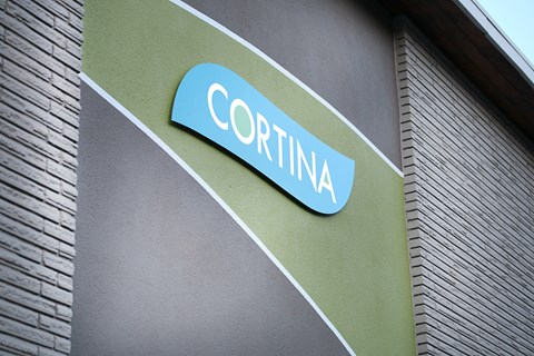 a sign on the side of a building that says