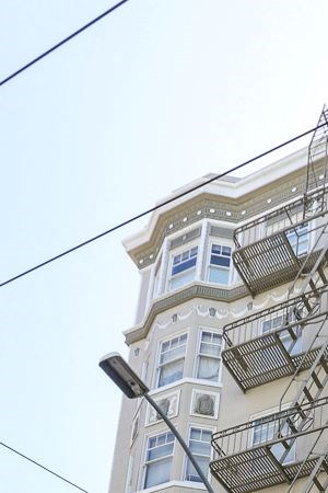 a tall building with several balconies on the side of it