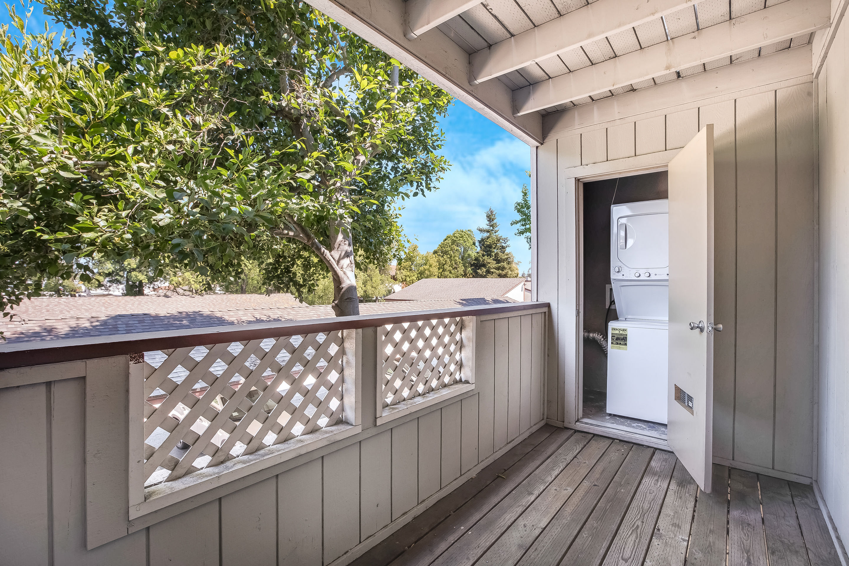 Newark Apartments-Alderwood Park-Covered Patio with Wood Flooring and Access to Washer and Dryer