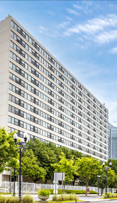 a tall building with a street in front of it