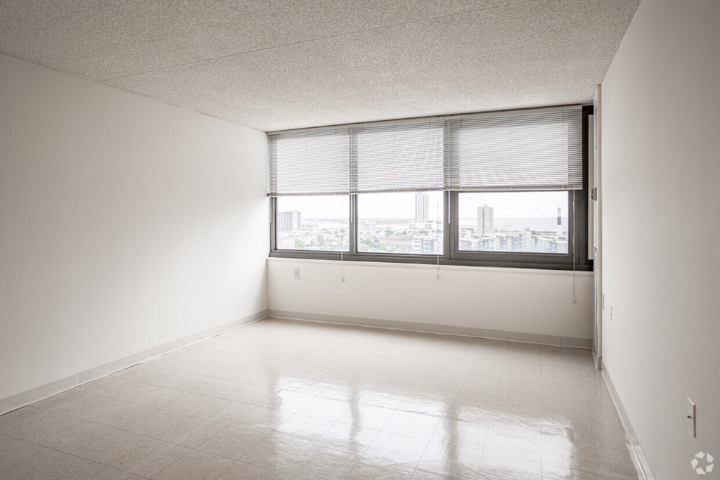 an empty room with a large window and