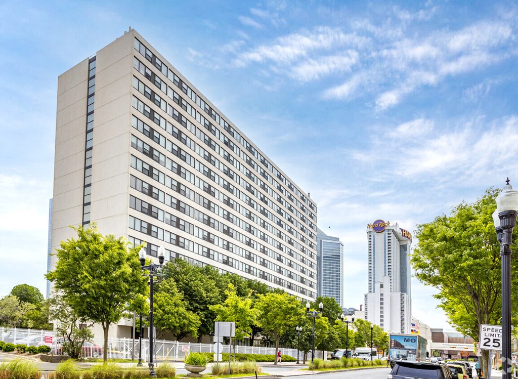 a view of a large hotel in a city with a blue sky