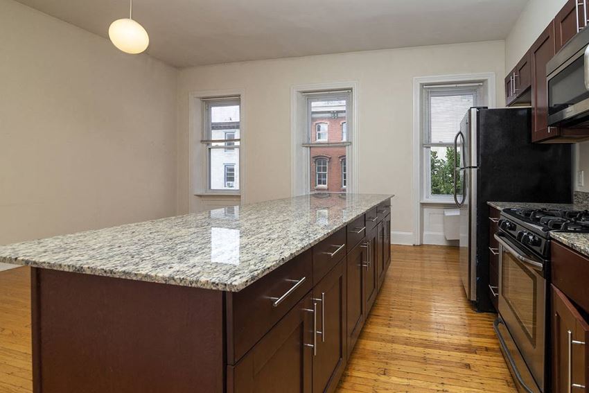 a kitchen with a granite counter top and a large island