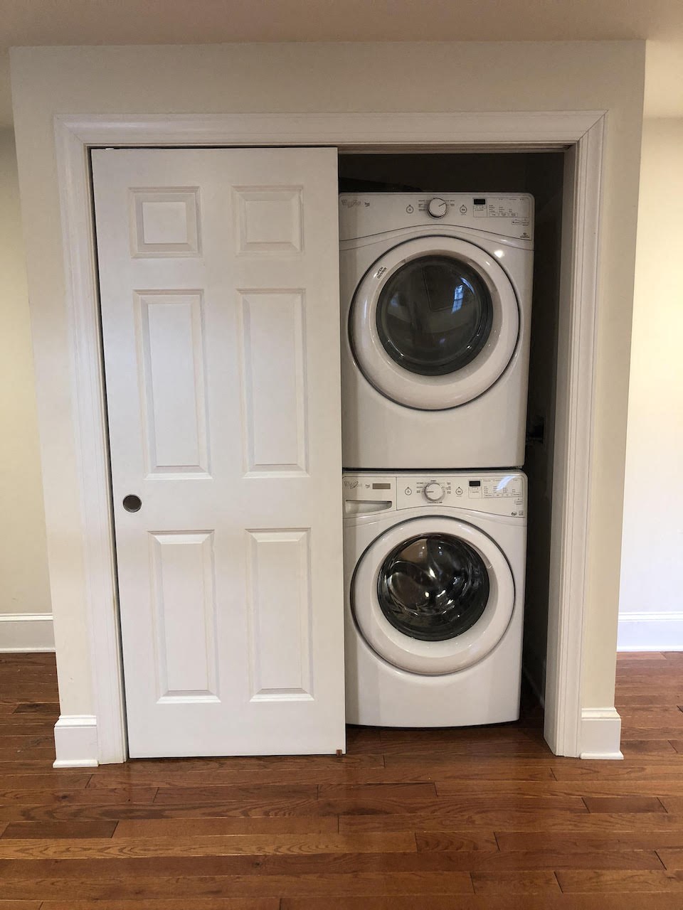 a stacked washer and dryer in a closet