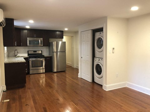 a kitchen with a washer and a dryer in it