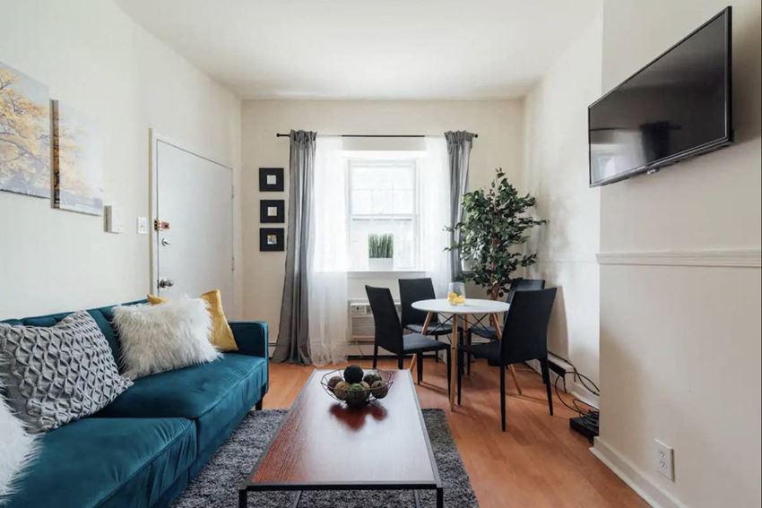 a living room with a couch and a table and a tv