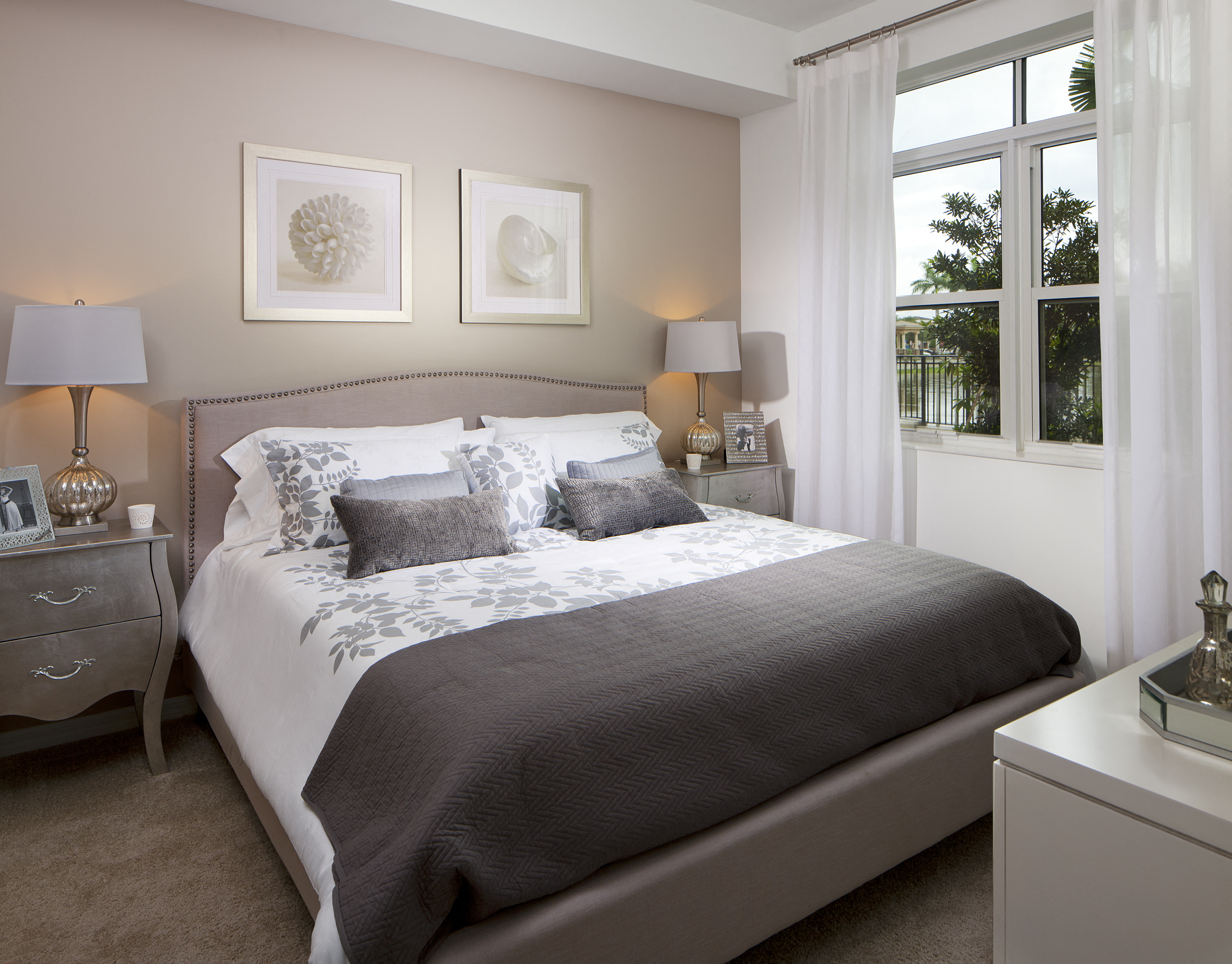 a bedroom with a bed and two windows