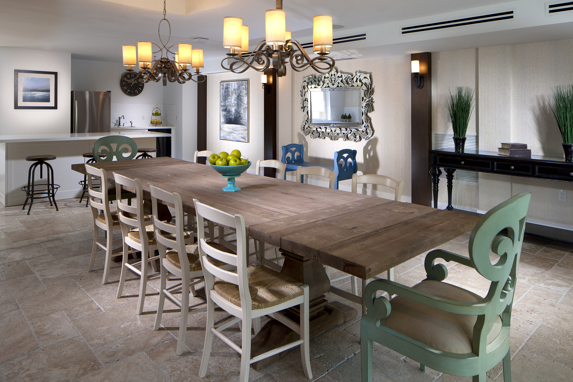 a dining room with a wooden table and chairs