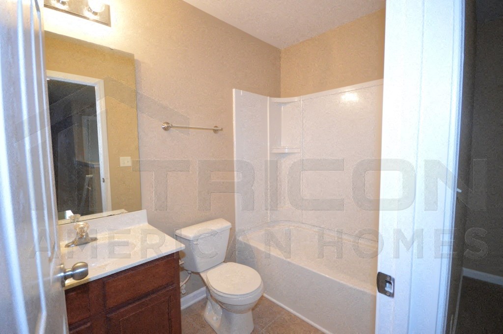 a small bathroom with a toilet and a shower
