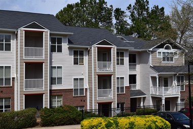 Residences with balconies at The Falls Apartments in Raleigh