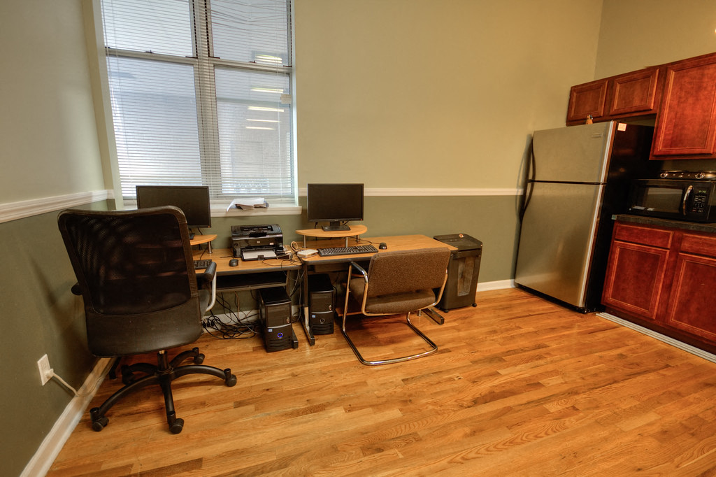 Community room with refrigerator, microwave, desks and computers