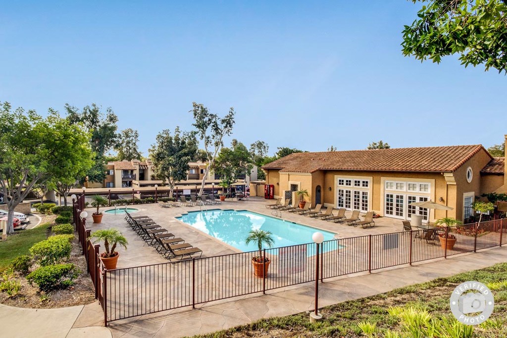 our apartments have a pool and a patio with chairs