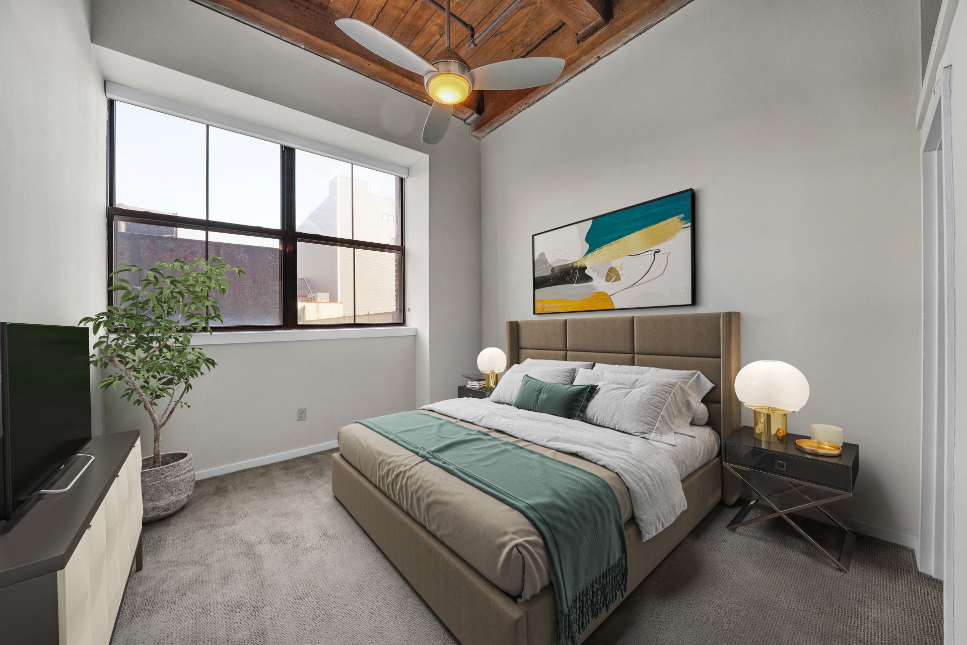 a bedroom with a bed and a ceiling fan