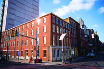 a red brick building on the corner of a city street