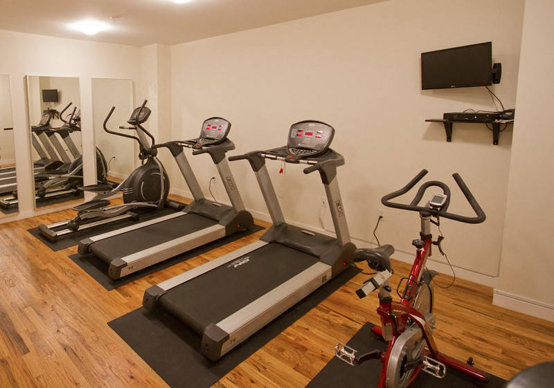 Gym and fitness center with treadmills, ellipticals and spin bikes