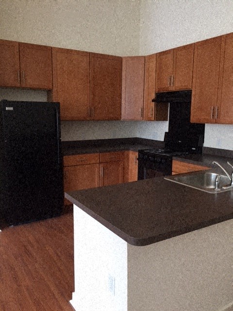 a kitchen with a counter top and a sink