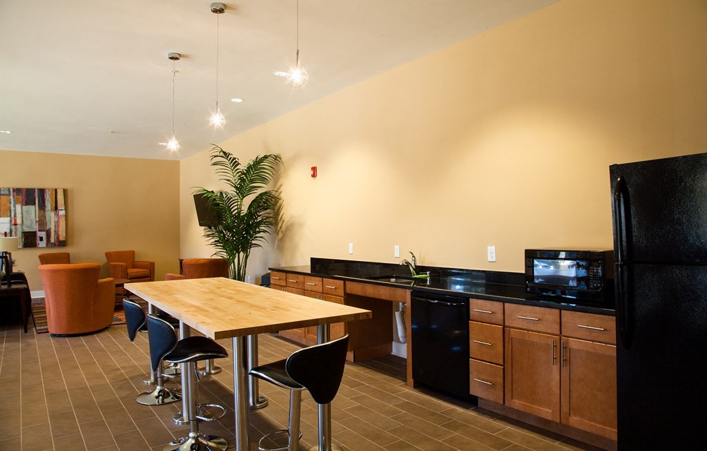 a kitchen and dining room with a table and chairs