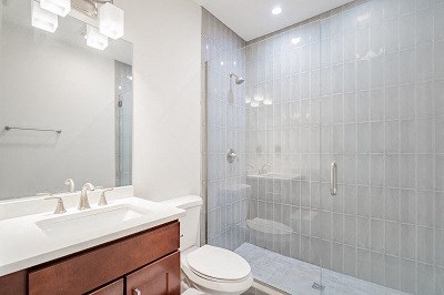 a bathroom with a shower toilet and a sink
