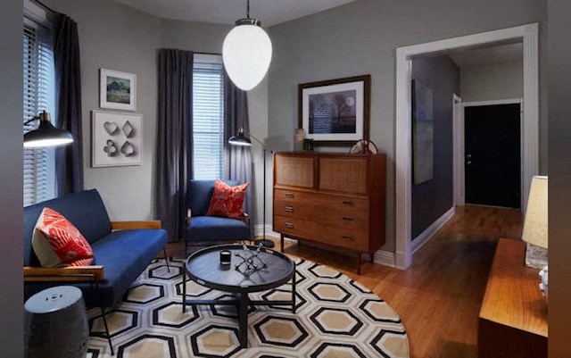 a living room with a blue couch and a coffee table
