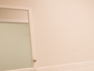 Bathroom with white cabinets and white tile floors - Photo Gallery 5