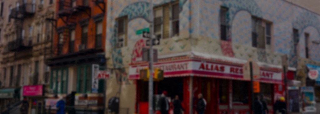 a blurry picture of a restaurant on a city street