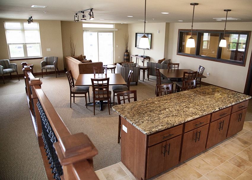 an open living room and dining room with a granite counter top