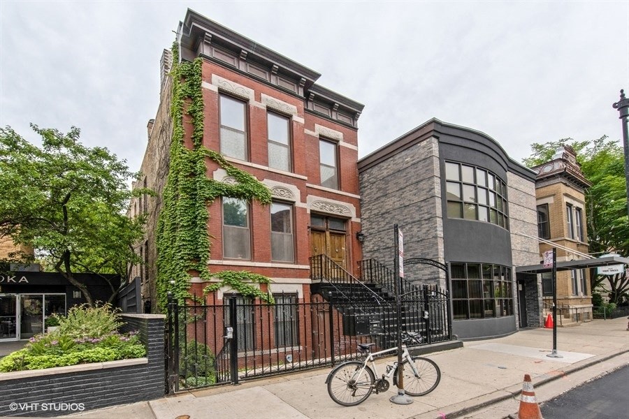 the facade of a building with a bike parked in front of it