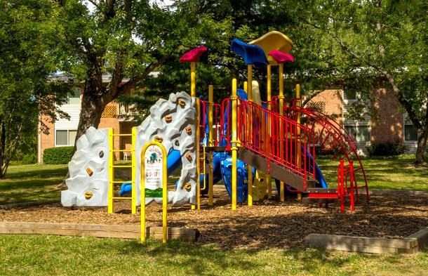 a colorful playground with a slide and other toys