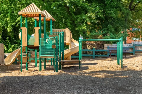 a playground with a slide and other playground equipment