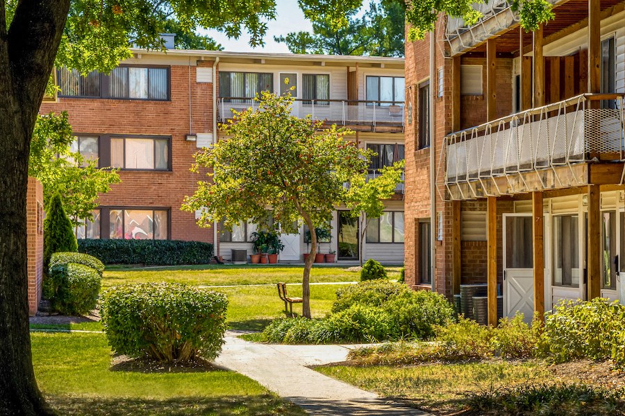 our apartments are located in a quiet neighborhood with a lawn and trees