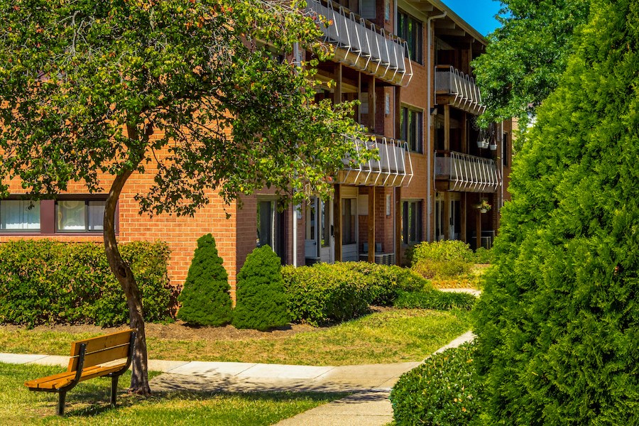 a bench sitting in front of a building
