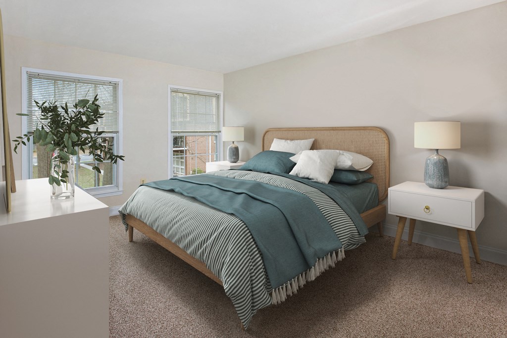 a bedroom with a bed and two windows