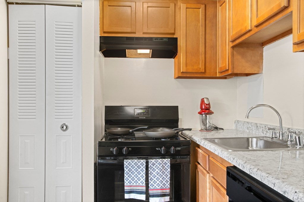 a kitchen with a stove and a sink