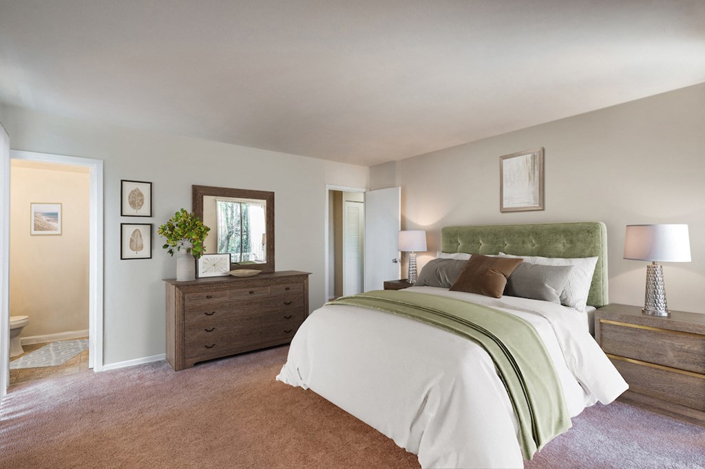 a bedroom with a bed and a dresser