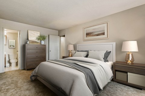 a bedroom with a bed and a bathroom with a toilet