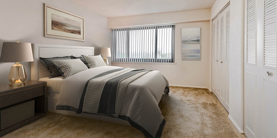 a bedroom with a bed and a window